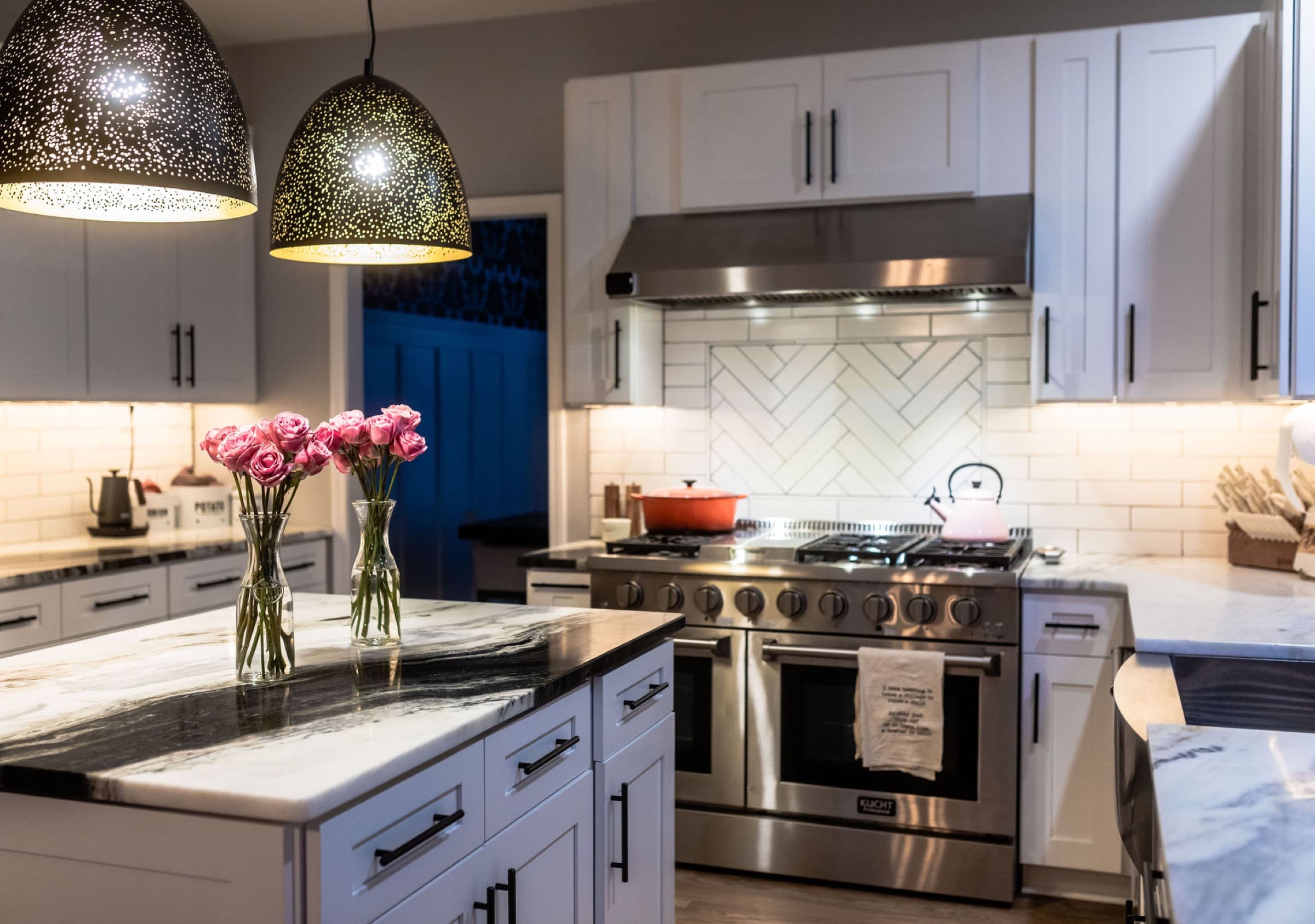 Custom kitchen remodel with white cabinetry and island completed by 5 Stones Renovation in Canton, GA