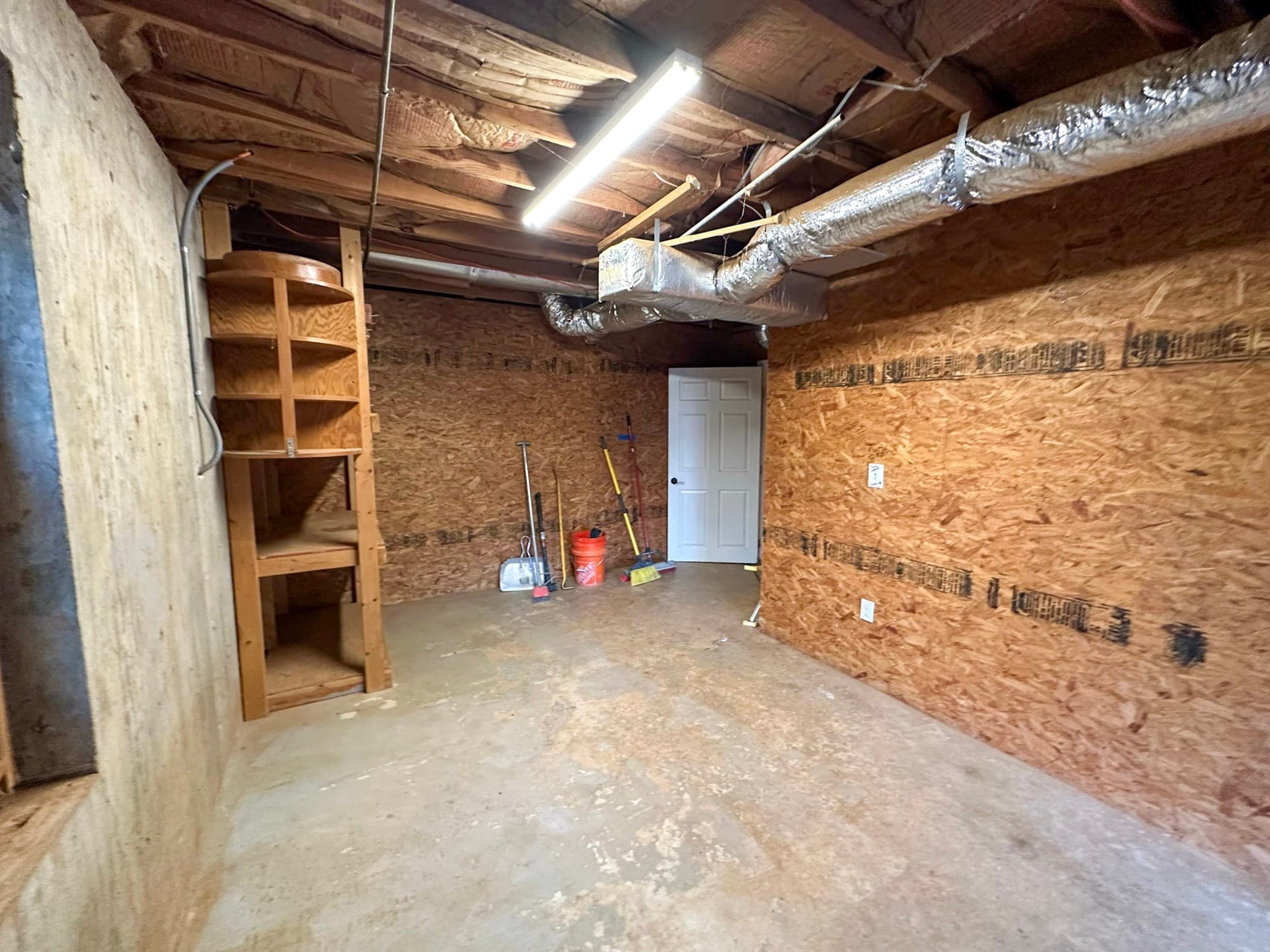 Ball Ground basement before renovation — unfinished space