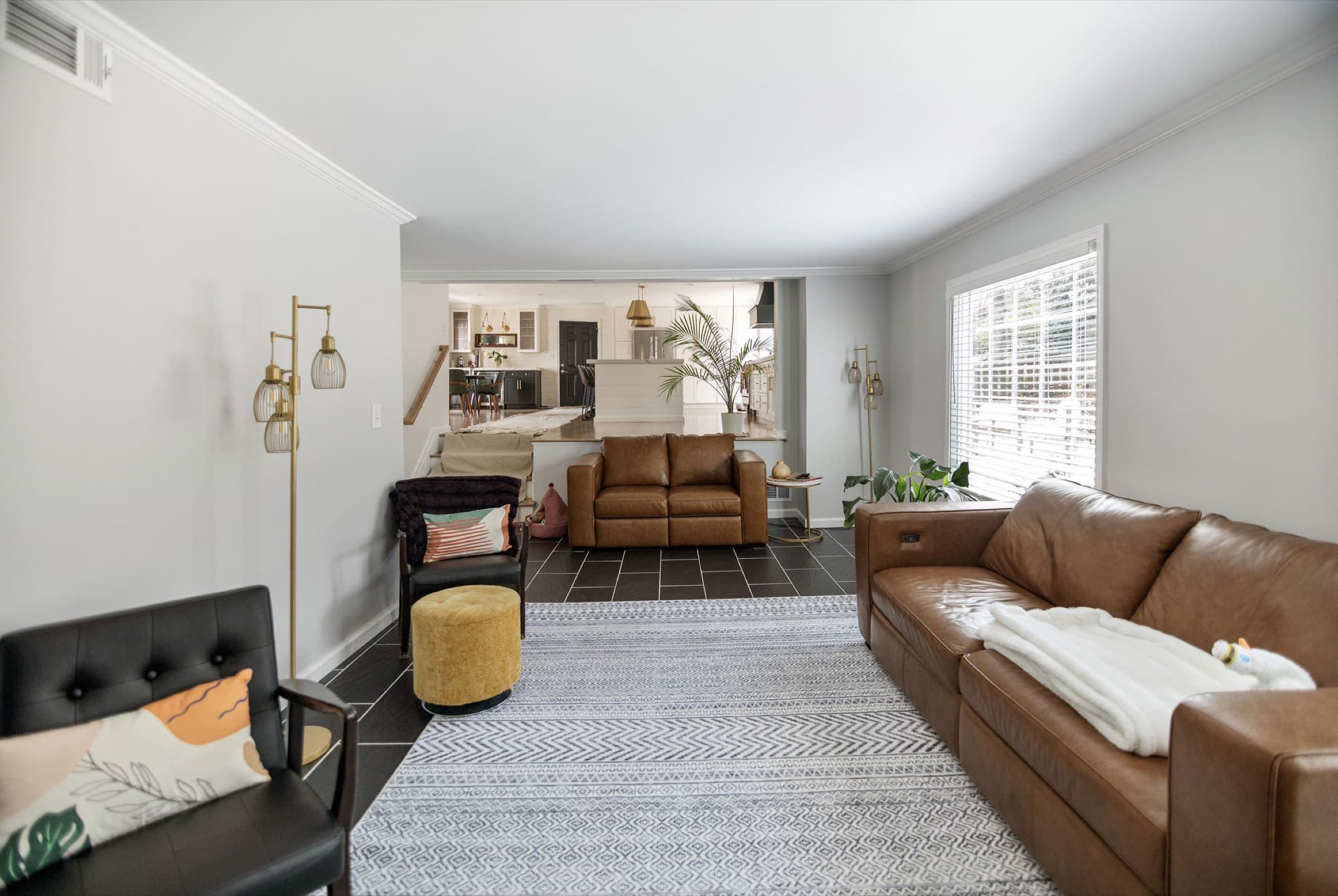 Candlestick Ct renovation — living room opening into the kitchen and dining space
