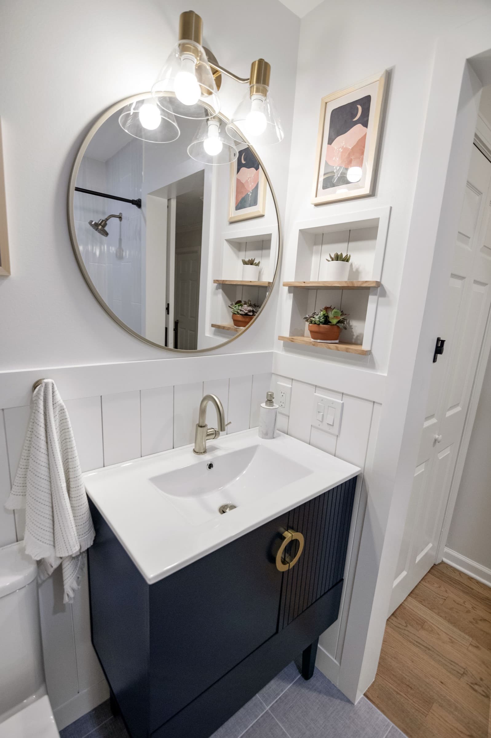 Candlestick Ct hall bathroom — built-in shelf niches beside the vanity mirror