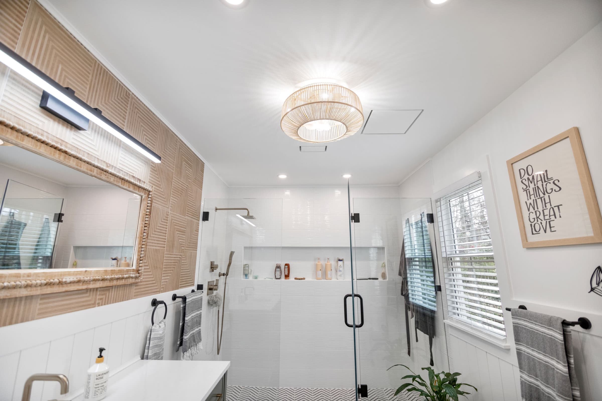 Candlestick Ct primary bathroom — view through the frosted sliding barn door from the bedroom