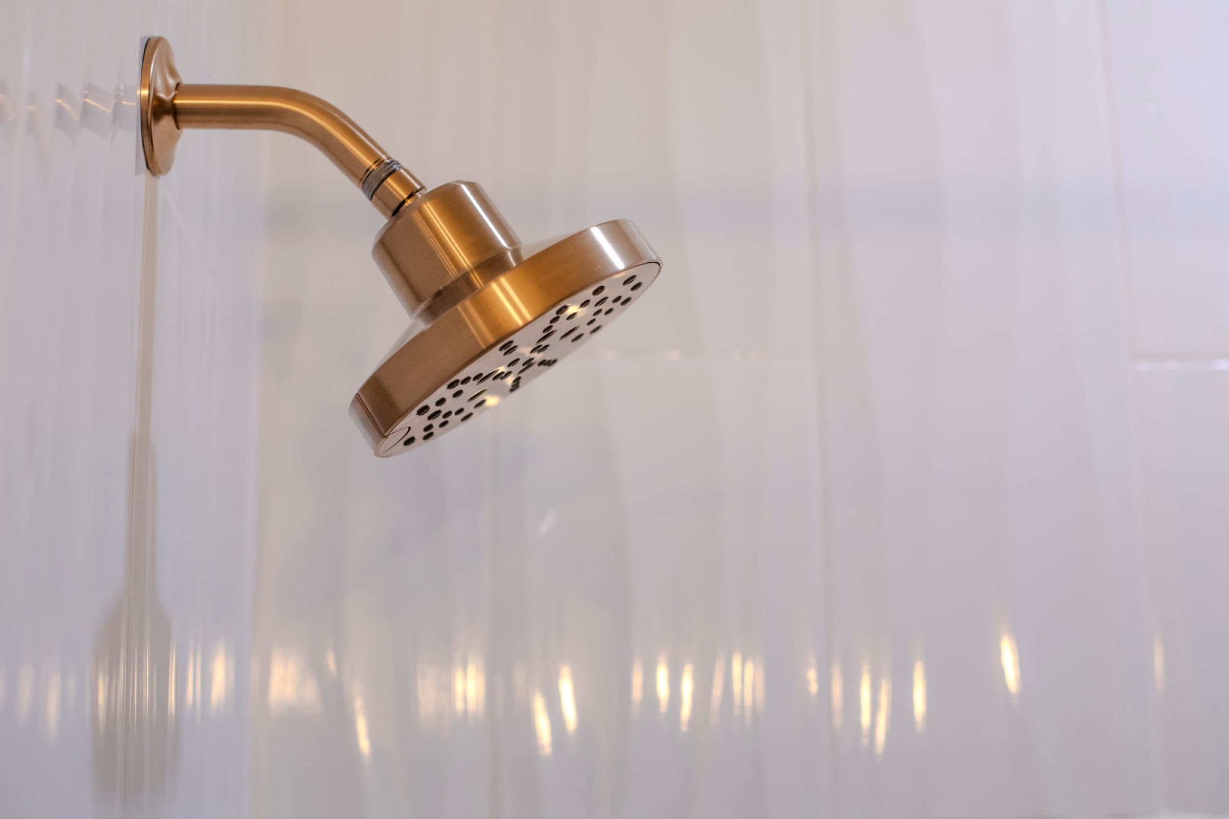 Candlestick Ct primary bathroom — brushed brass widespread faucet detail