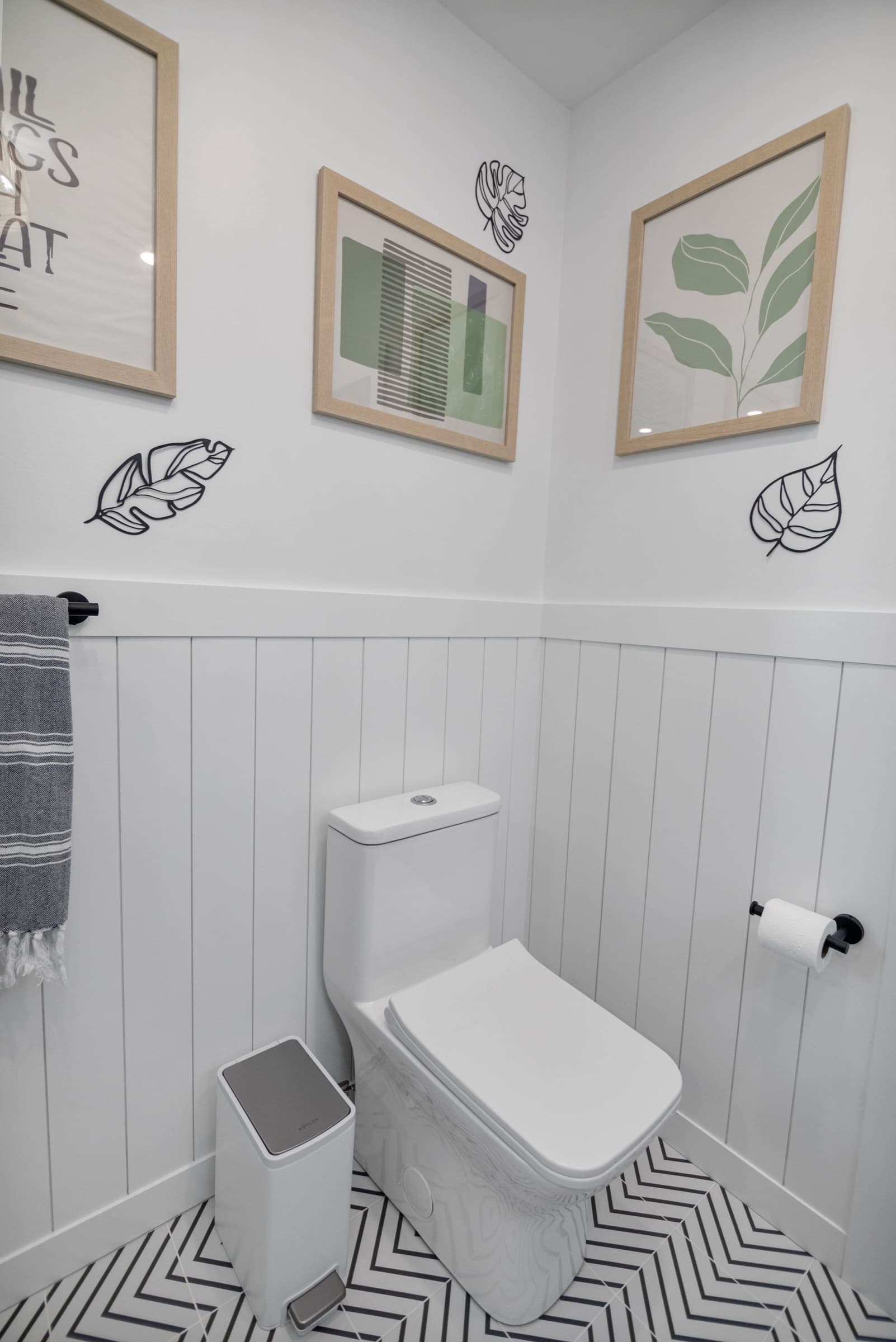 Candlestick Ct primary bathroom — attached water closet with botanical wall art