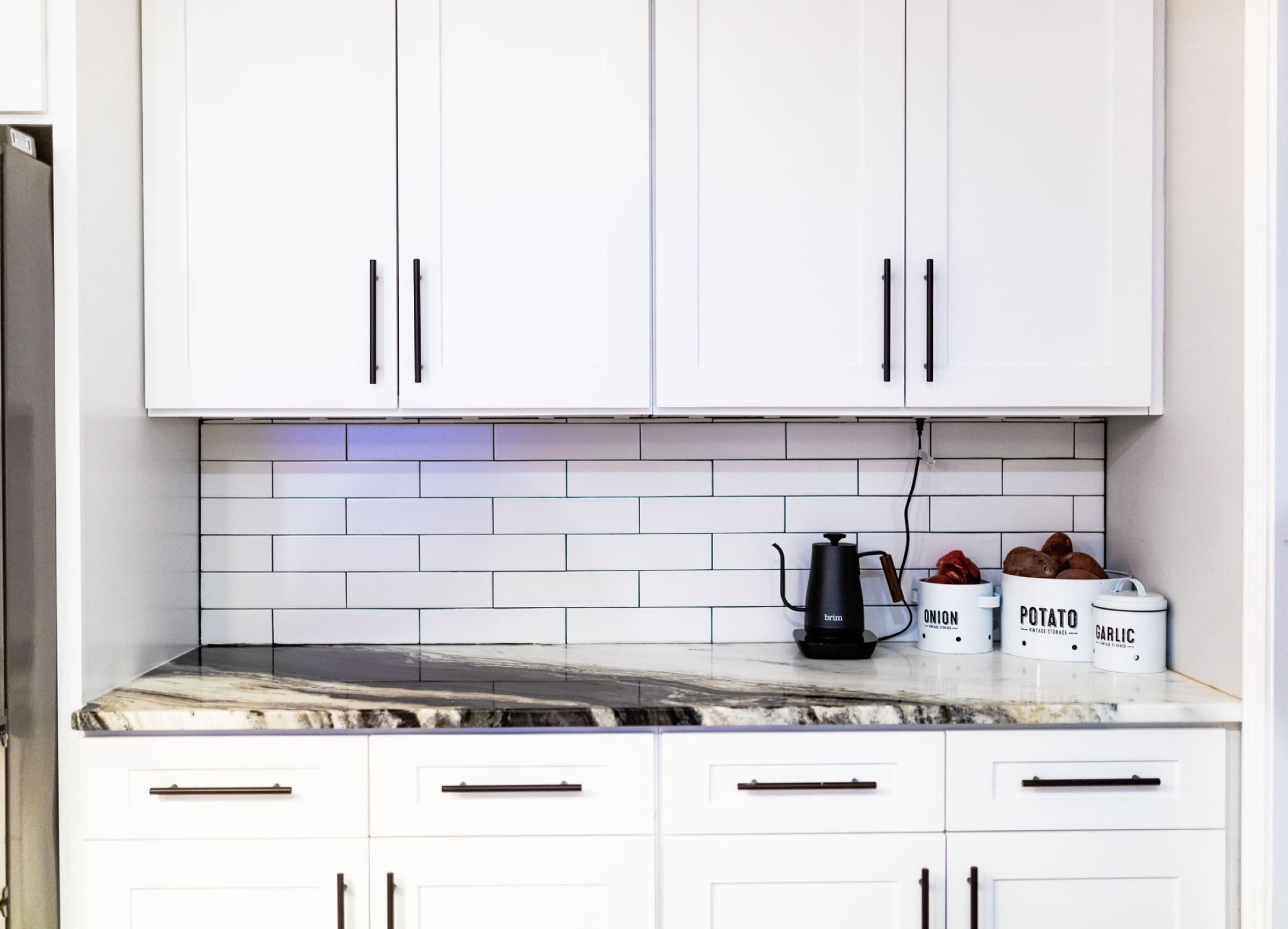 Canton kitchen remodel — under-cabinet outlet and canister detail