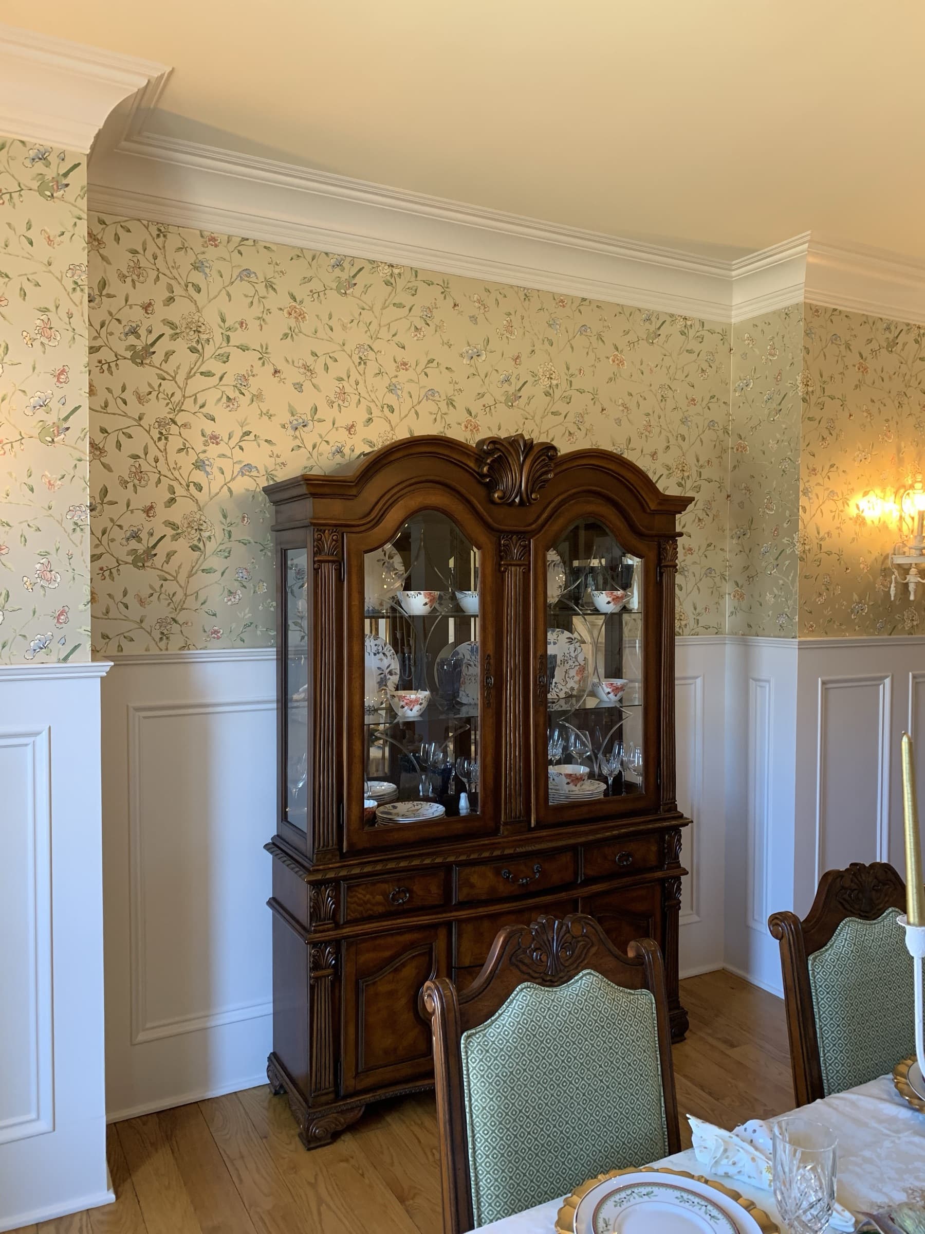 Custom carved wood china cabinet with beveled glass doors