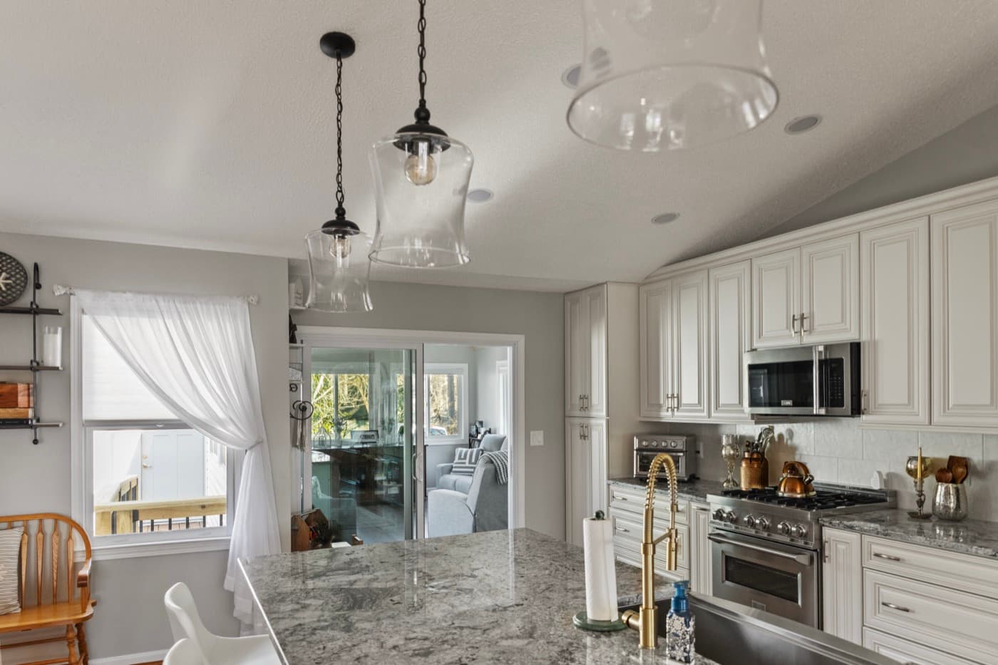 Galts Ferry kitchen remodel — island with pendant lighting, view to sunroom