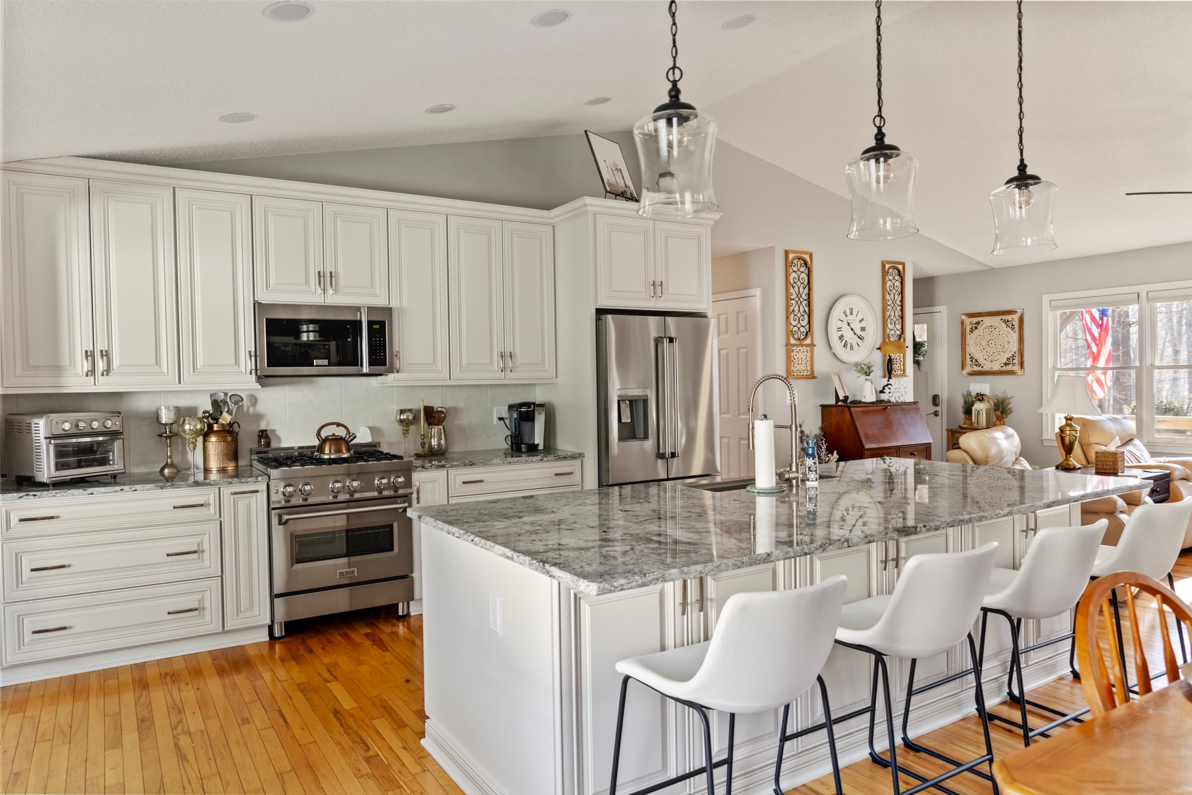 Galts Ferry kitchen remodel — island seating, refrigerator, and wall decor