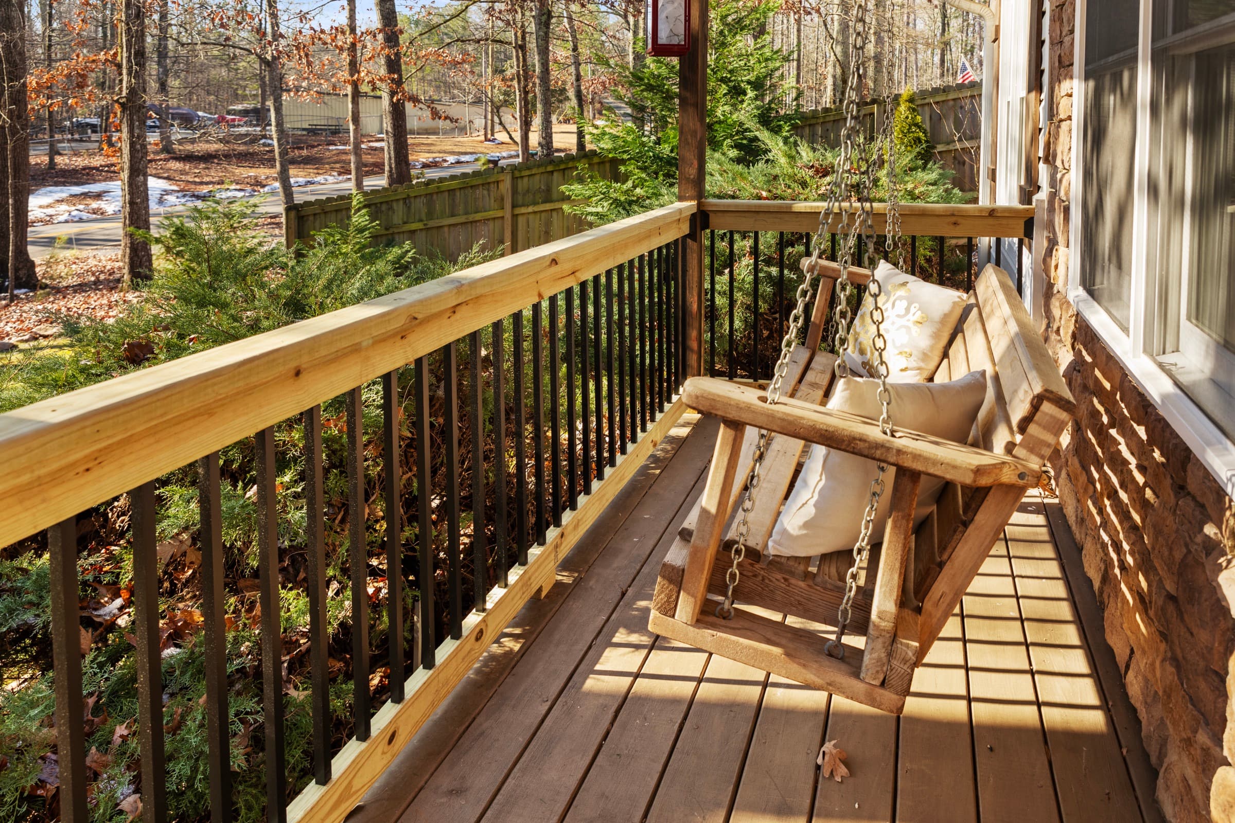 Galts Ferry porch — wood porch swing with cable railing