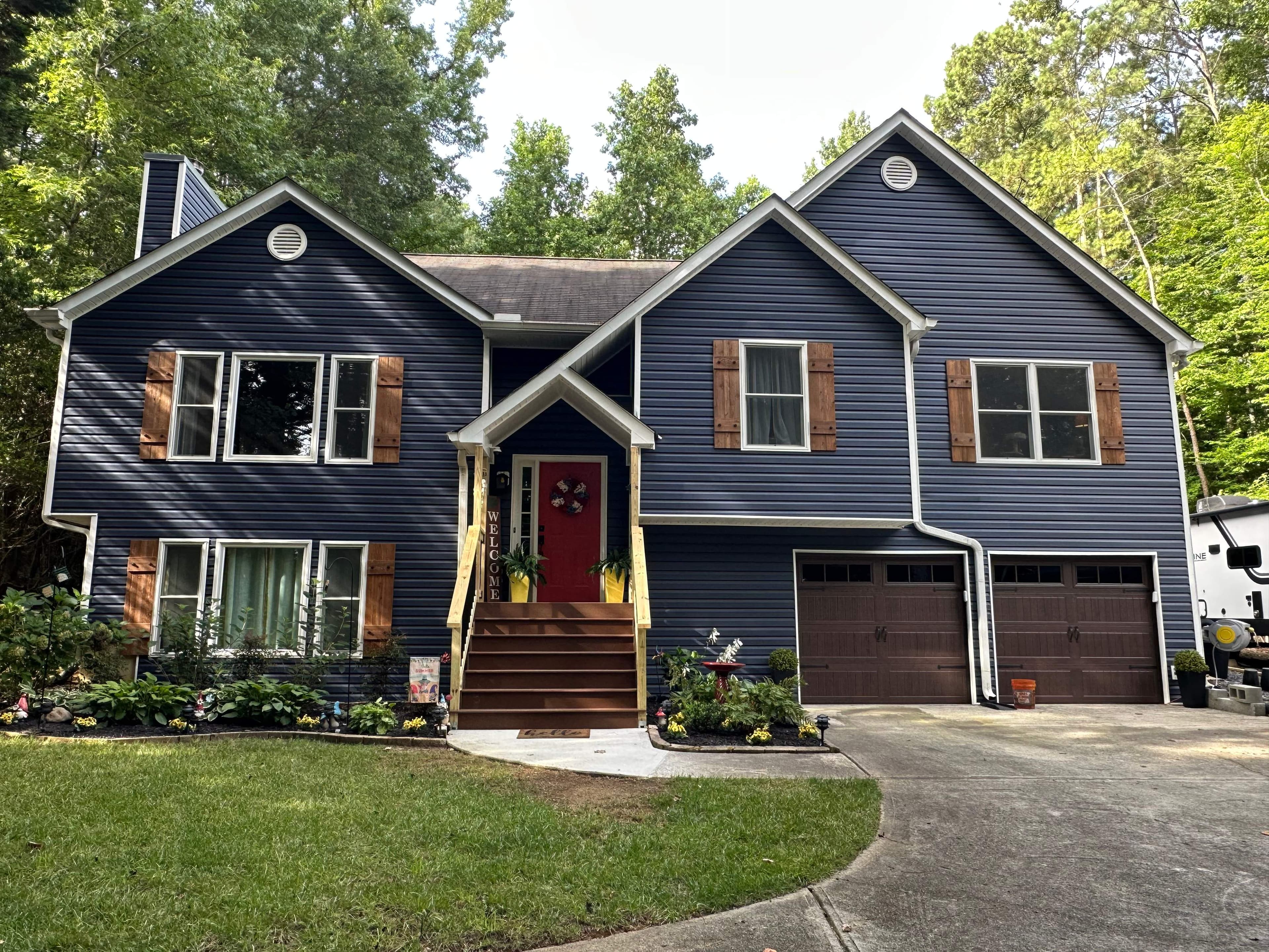 Maddox Rd exterior renovation — full front elevation with new siding and composite front steps