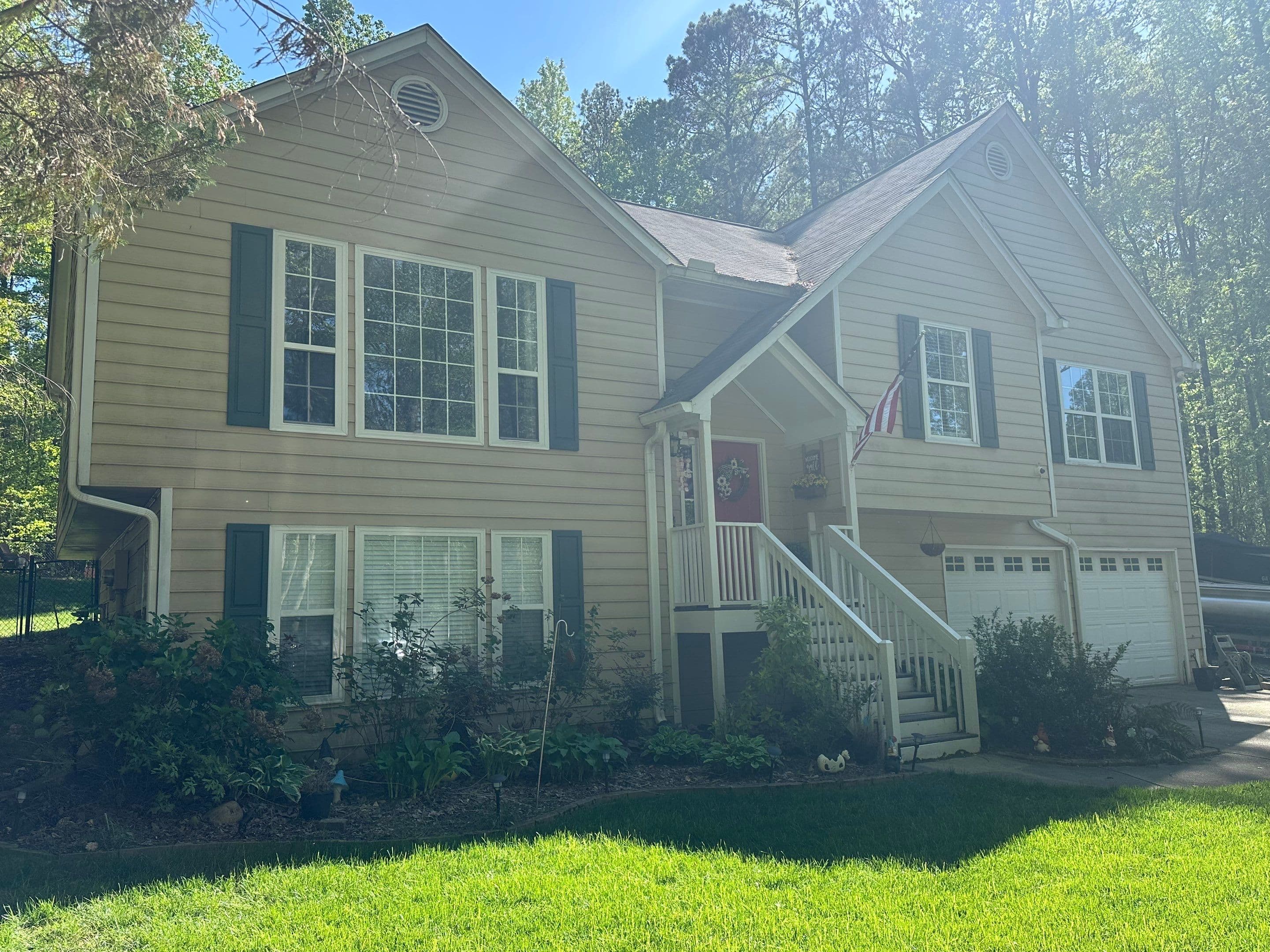 37 Maddox Rd exterior before renovation — tan vinyl siding and original front stairs
