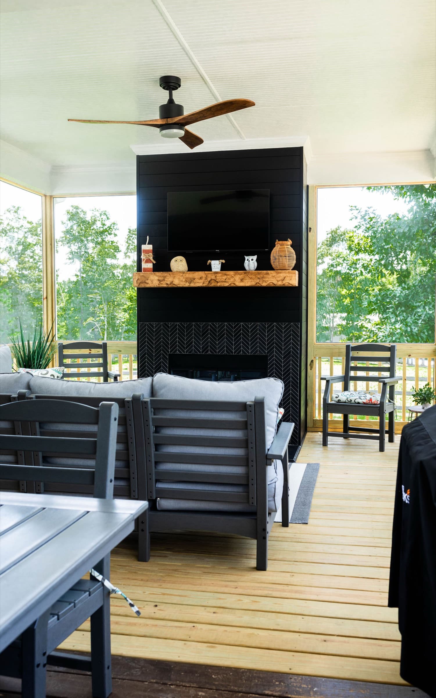 Mt. Carmel Church Ln screened porch — dining table with fireplace in view