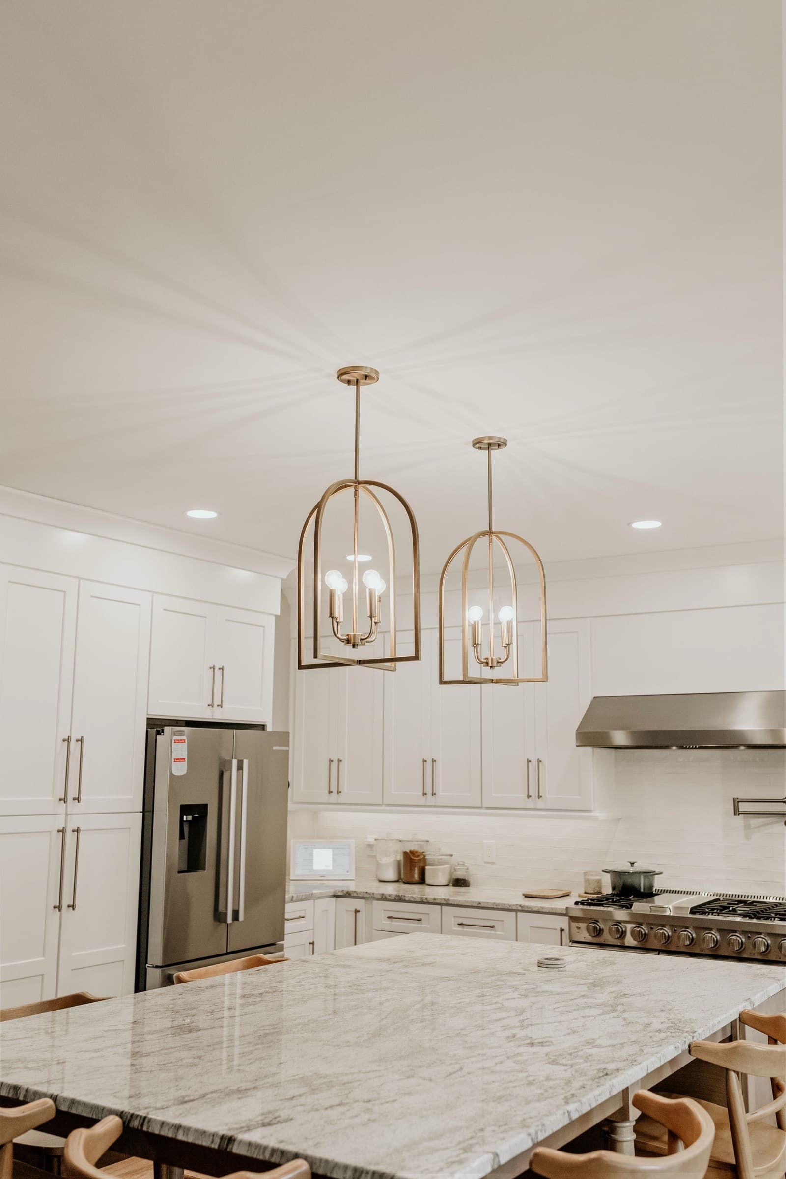 Powder Springs kitchen remodel — wide view of pendant lighting and cabinetry