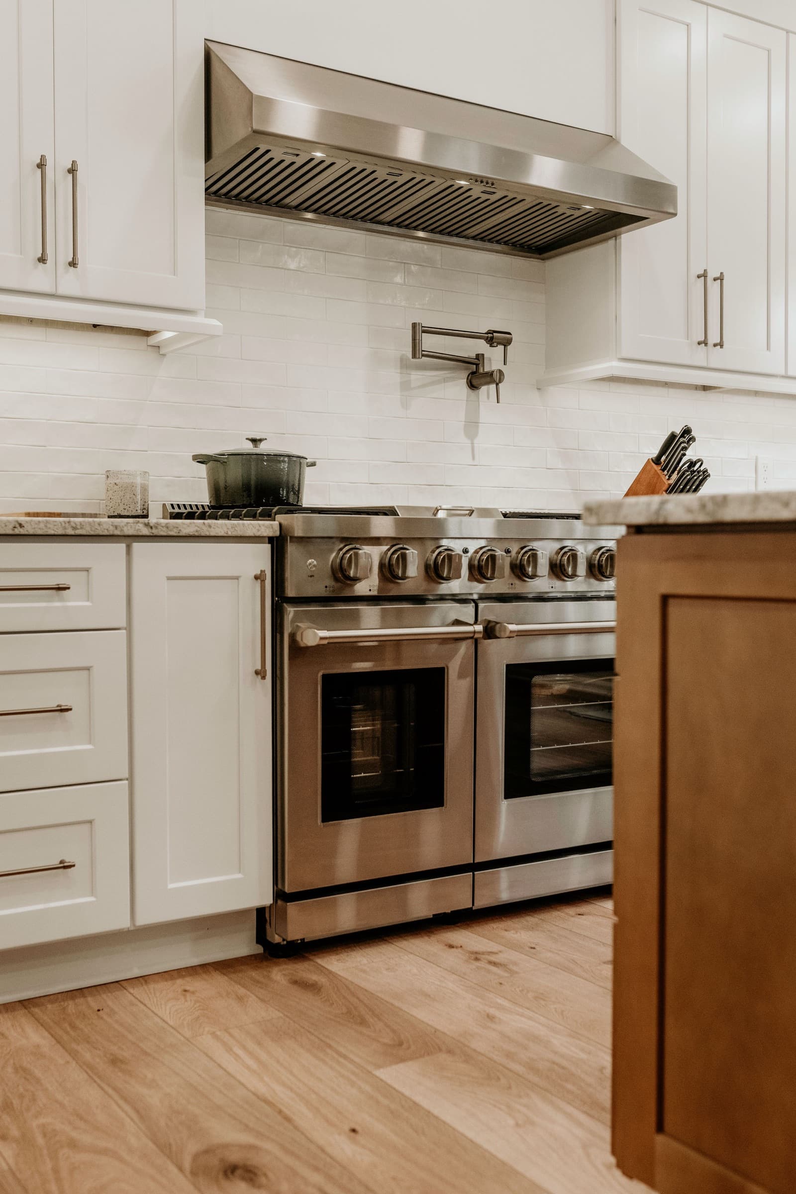 Powder Springs kitchen remodel — range hood and subway tile backsplash detail